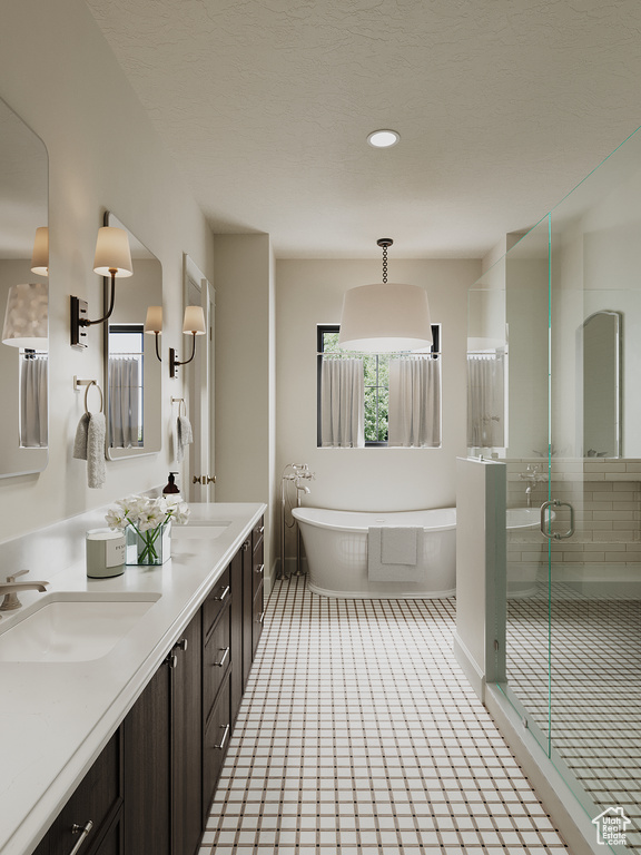 Full bath with a soaking tub, double vanity, a shower stall, tile patterned floors, and recessed lighting