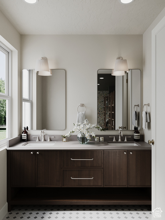 Bathroom with double vanity and a shower