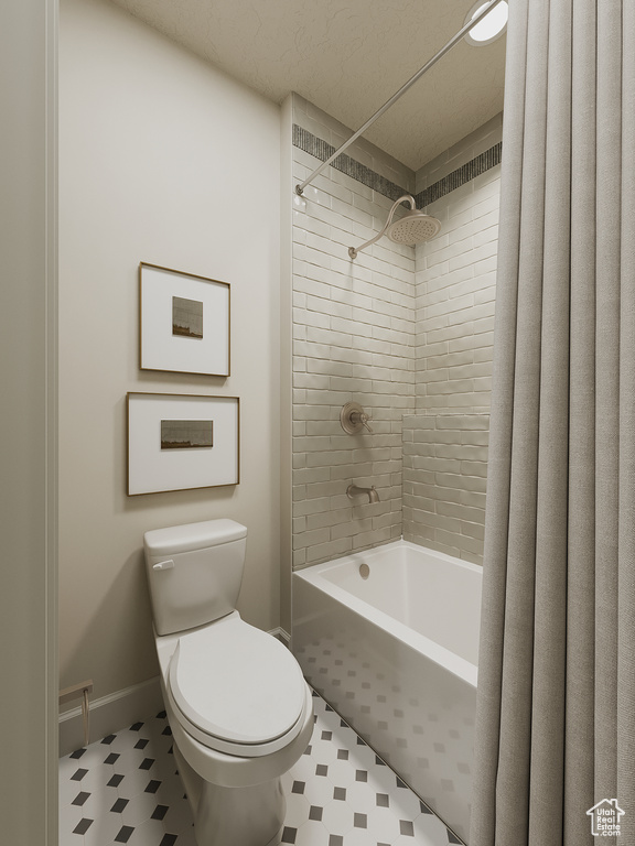 Bathroom with tile patterned floors and shower / bath combination with curtain