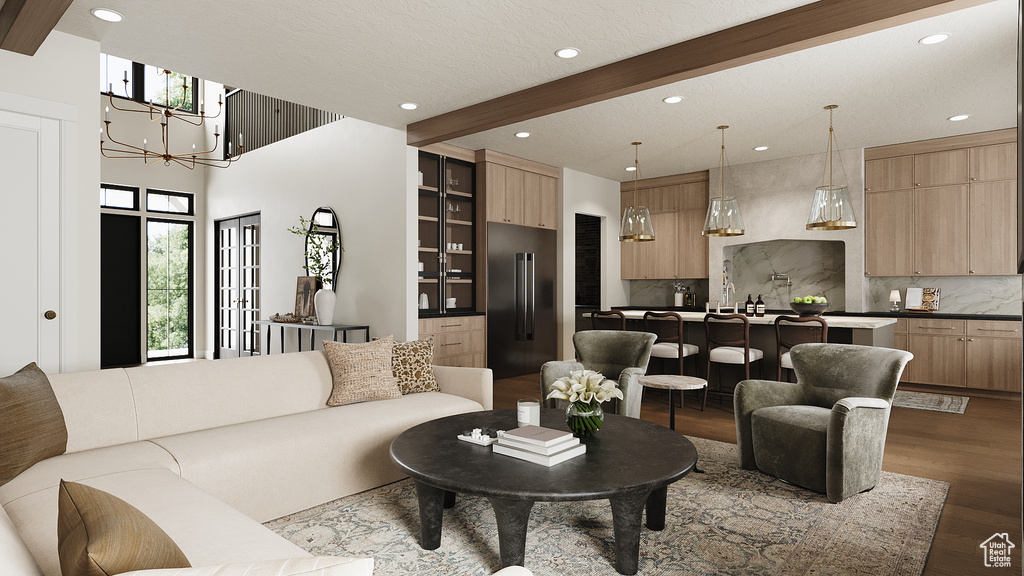 Living area with recessed lighting, dark wood-style flooring, beam ceiling, and a chandelier