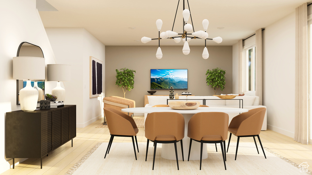 Dining room featuring light wood-style flooring, baseboards, and a chandelier