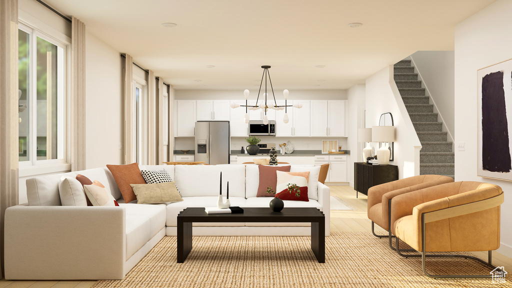 Living area featuring stairway and an inviting chandelier