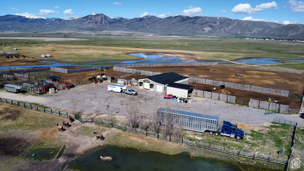 Aerial view of sparsely populated area with a water and mountain view