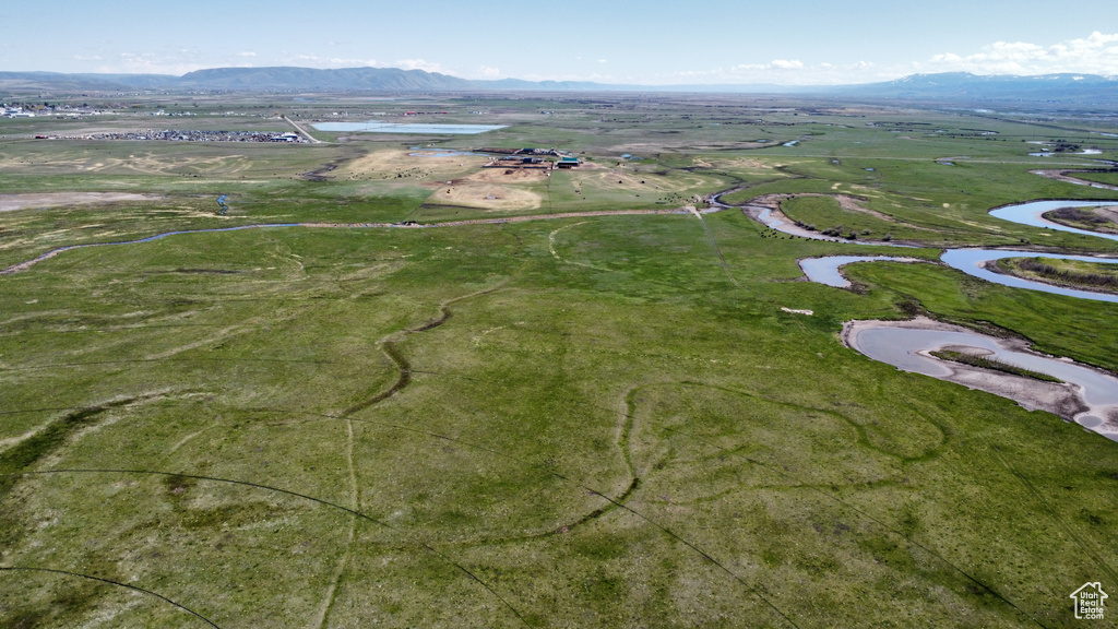 View of property location with a water and mountain view