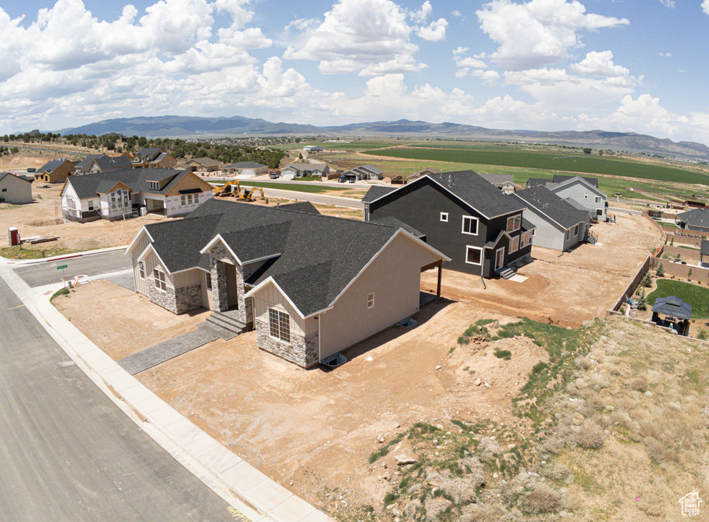 Aerial perspective of suburban area featuring a mountainous background