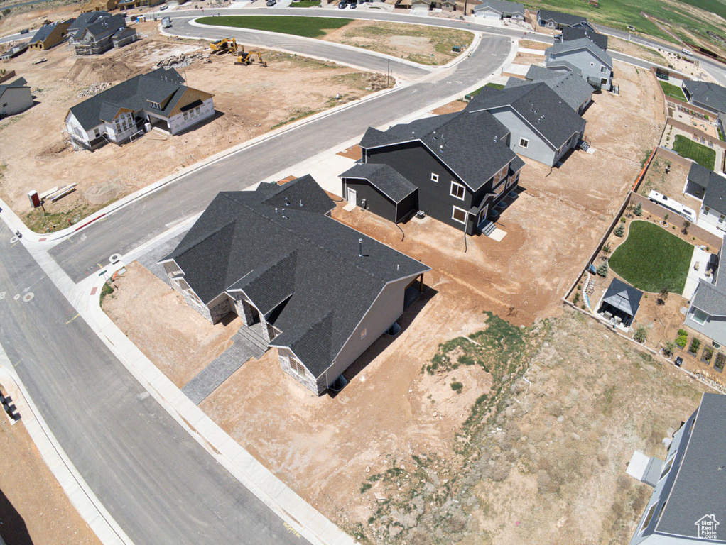 Aerial overview of property's location featuring nearby suburban area