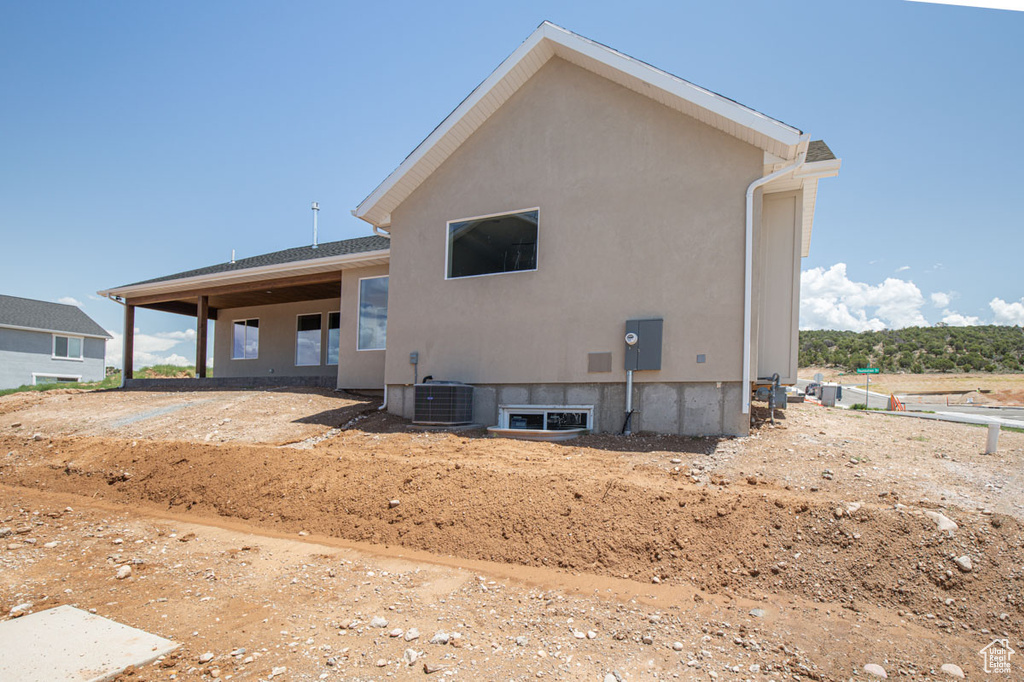 Back of house with stucco siding