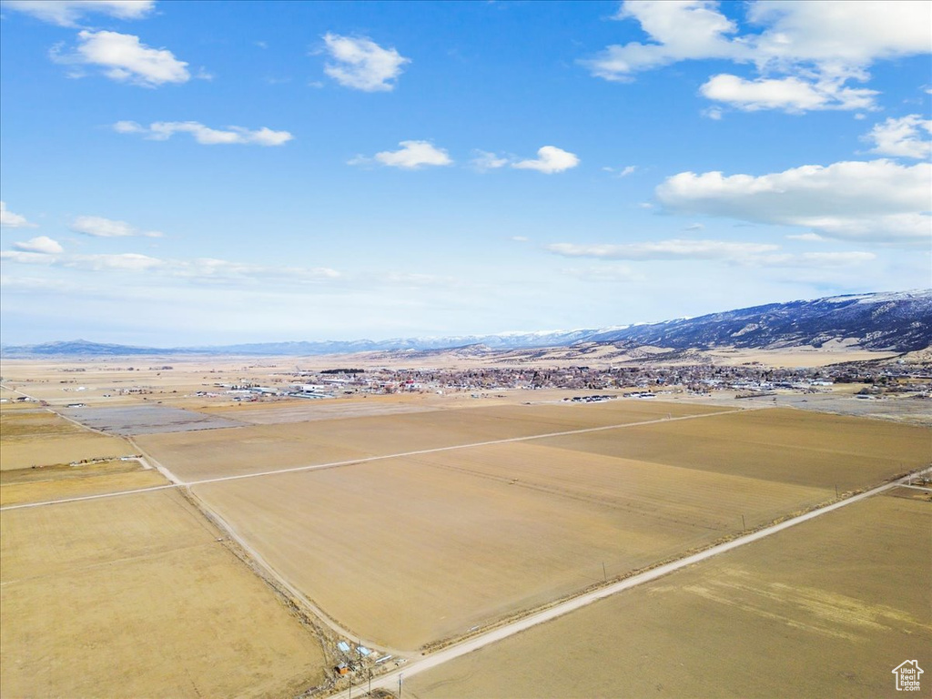 Birds eye view of property with a mountain view