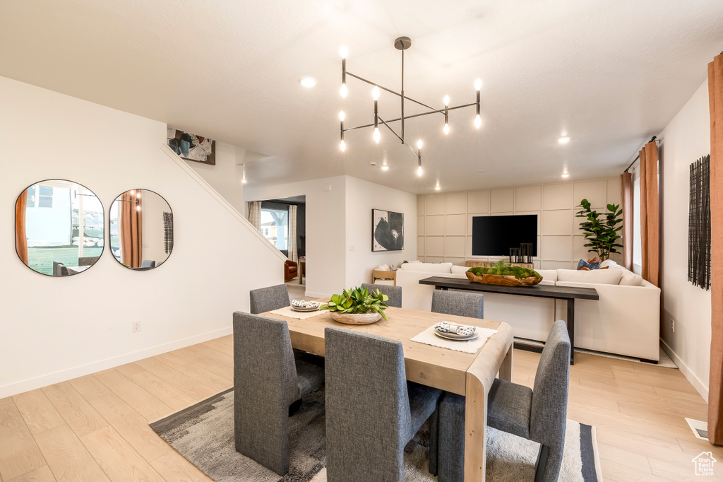 Dining space featuring baseboards and light wood finished floors