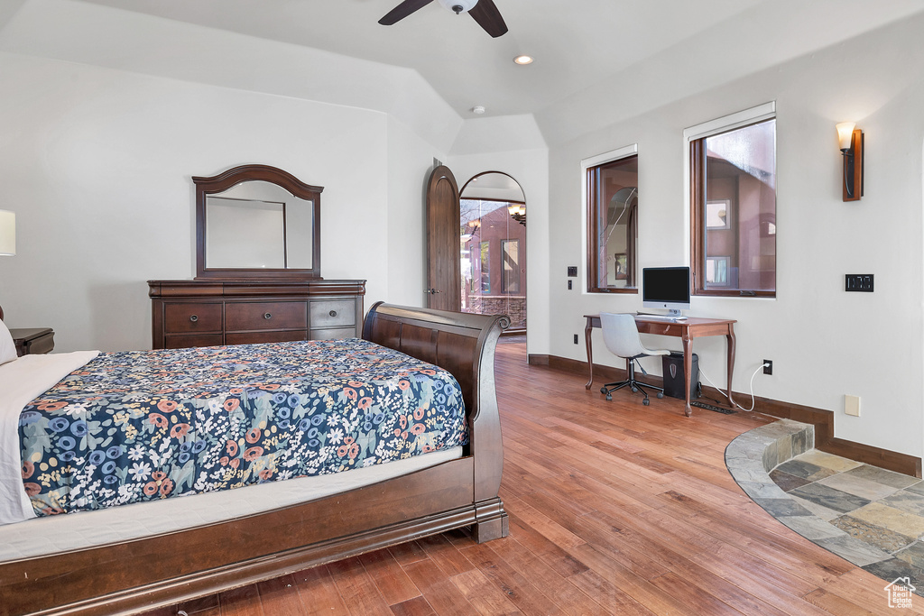 Bedroom with a ceiling fan, recessed lighting, wood finished floors, and baseboards