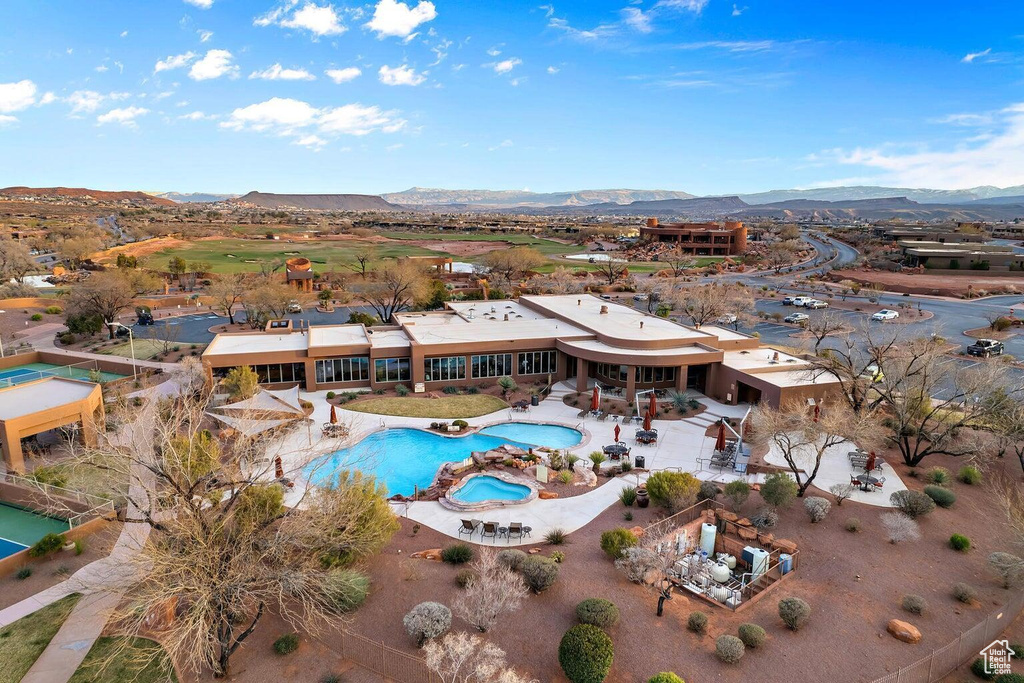 Aerial overview of property\'s location featuring a pool and mountains