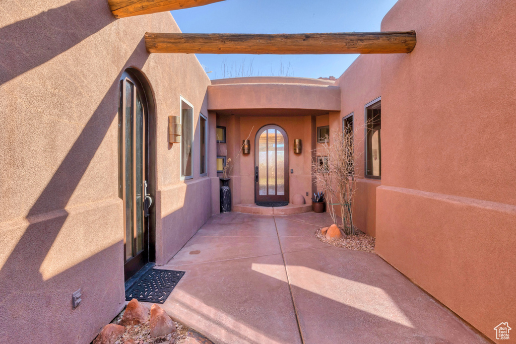 Doorway to property with stucco siding