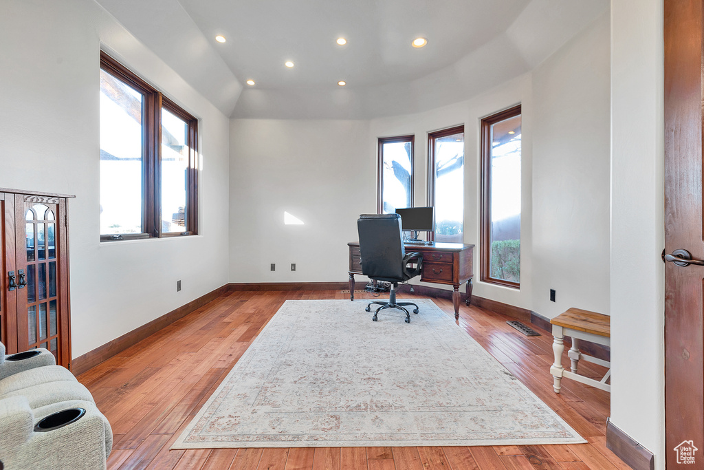 Office area featuring recessed lighting, baseboards, visible vents, and light wood-type flooring