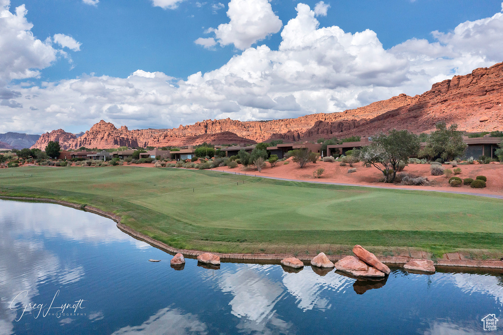 View of property\\\'s community with a water and mountain view and view of golf course