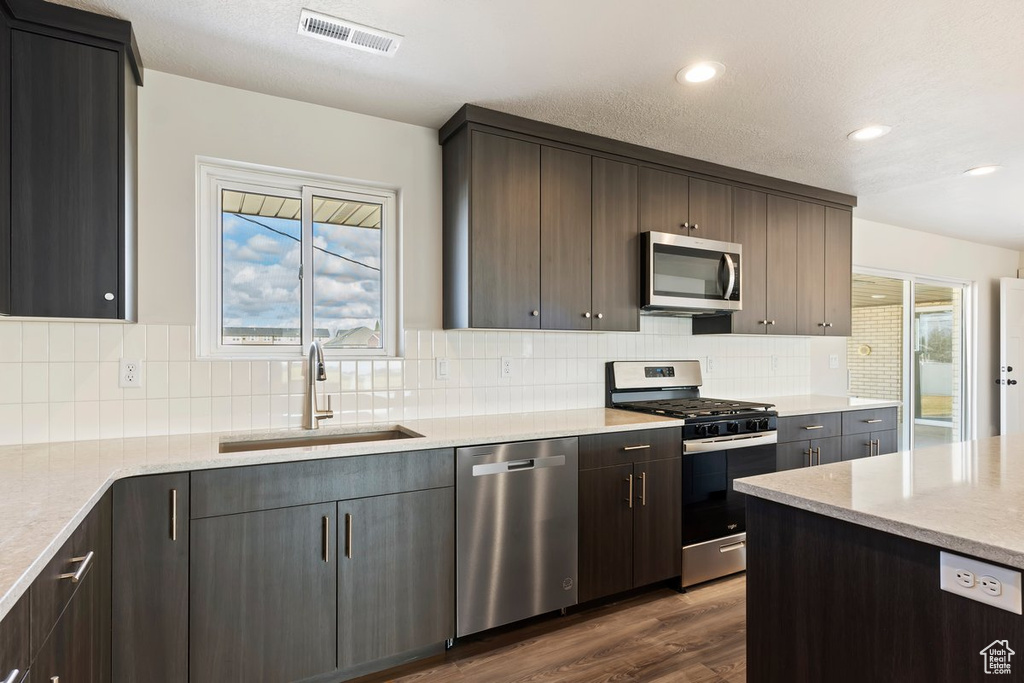 Kitchen with visible vents, a healthy amount of sunlight, appliances with stainless steel finishes, and a sink