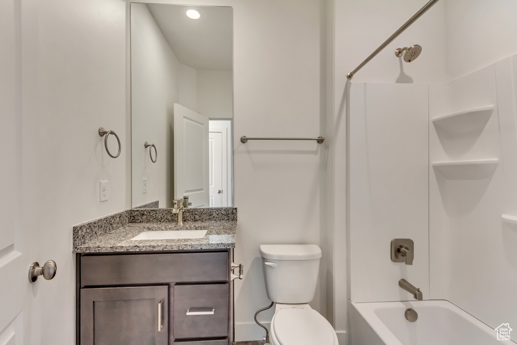 Full bathroom with shower / washtub combination, toilet, and vanity