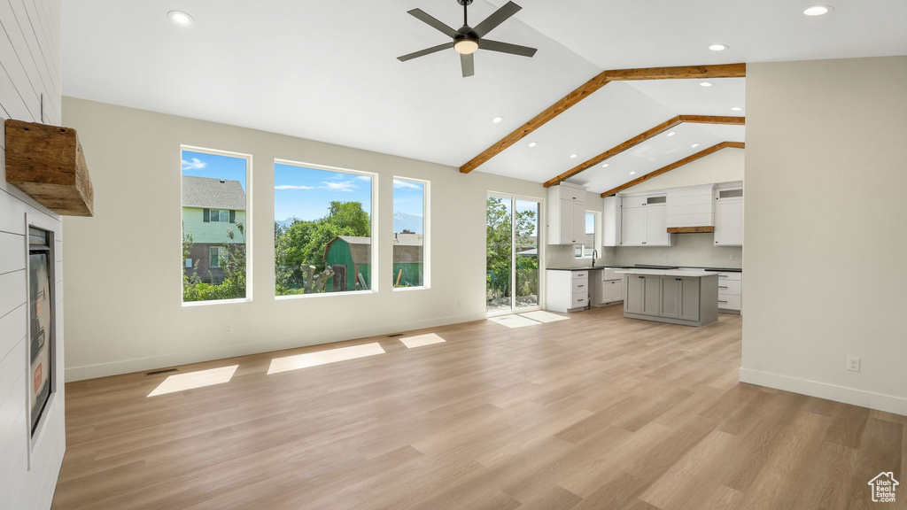 Unfurnished living room featuring recessed lighting, a ceiling fan, light wood-style floors, and high vaulted ceiling