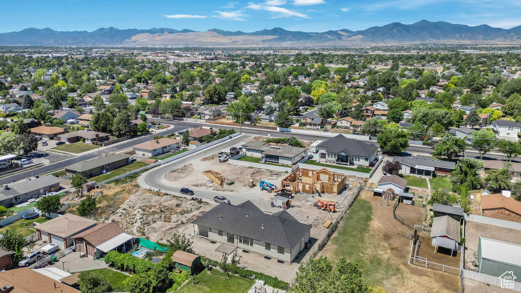 Aerial view of residential area featuring a mountainous background