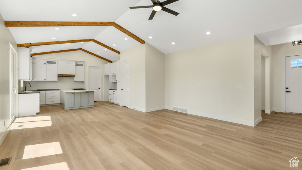 Unfurnished living room with a ceiling fan, light wood finished floors, and recessed lighting