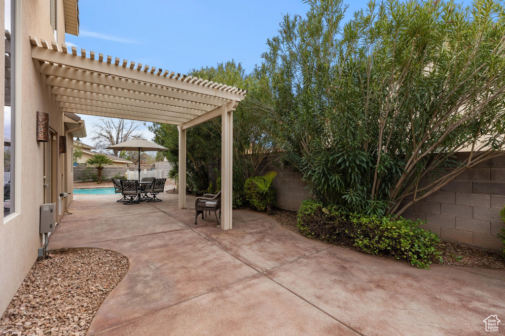 View of patio / terrace featuring outdoor dining space, a pergola, and a fenced backyard