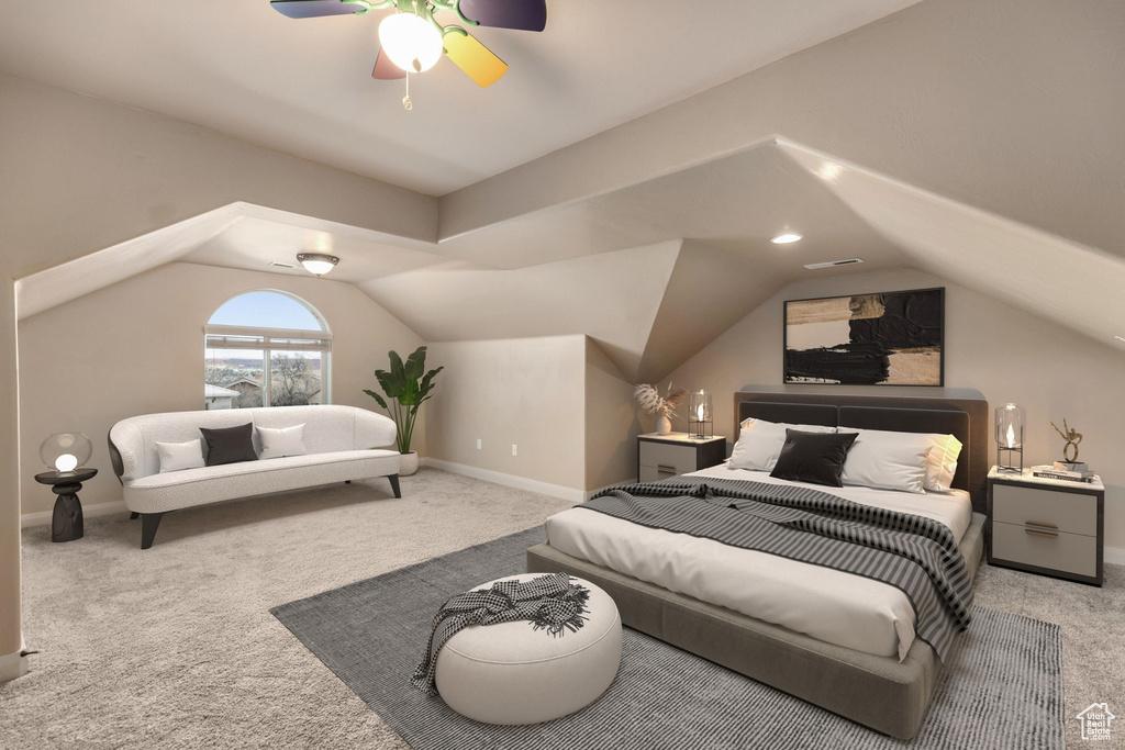 Bedroom featuring visible vents, baseboards, carpet, and vaulted ceiling