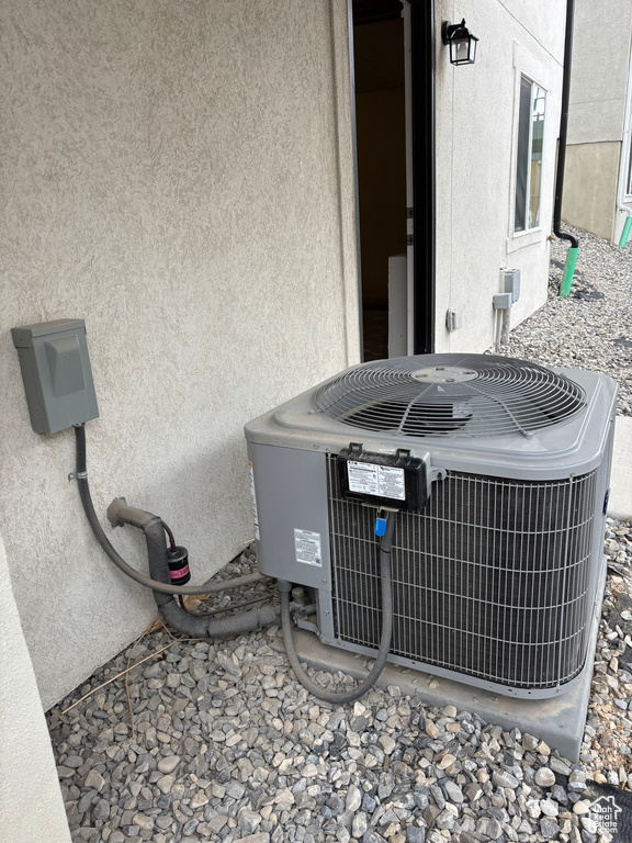 Details featuring stucco siding and central AC