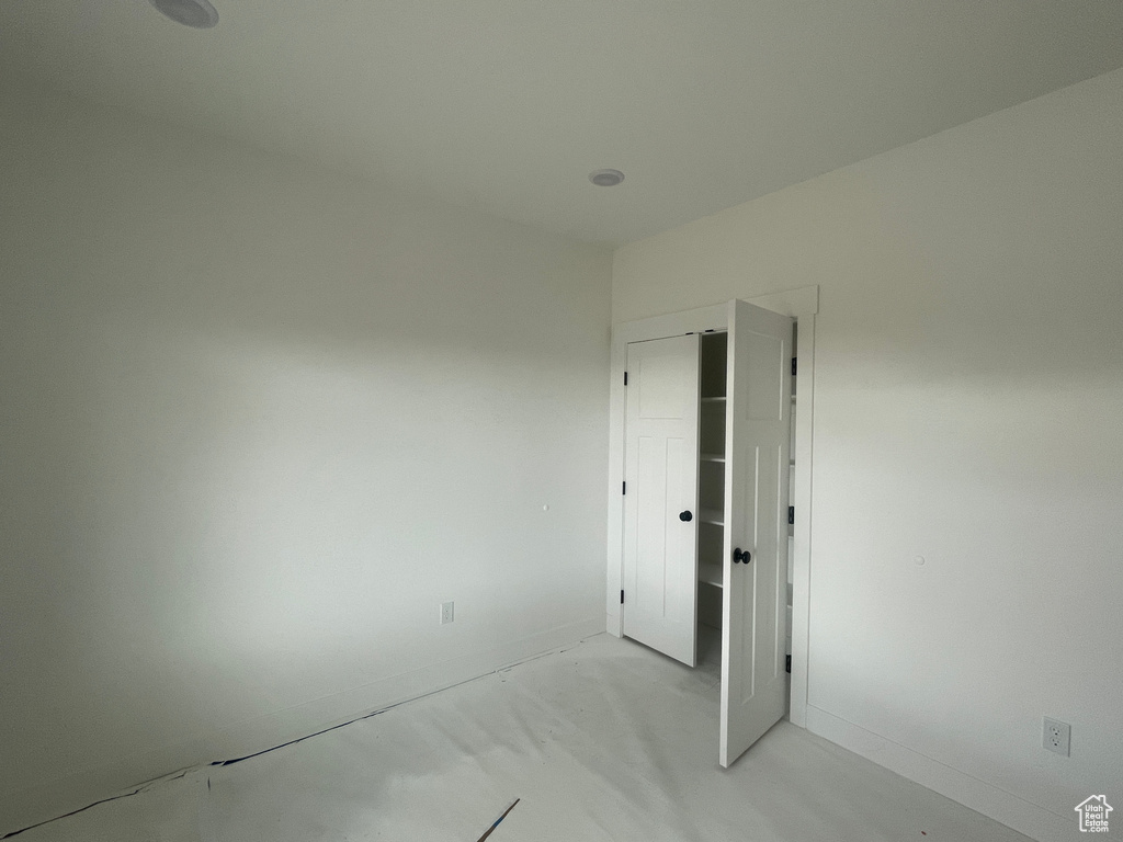 Unfurnished room featuring concrete floors