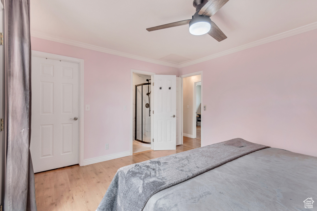Bedroom featuring ceiling fan, light wood-type flooring, baseboards, and ornamental molding