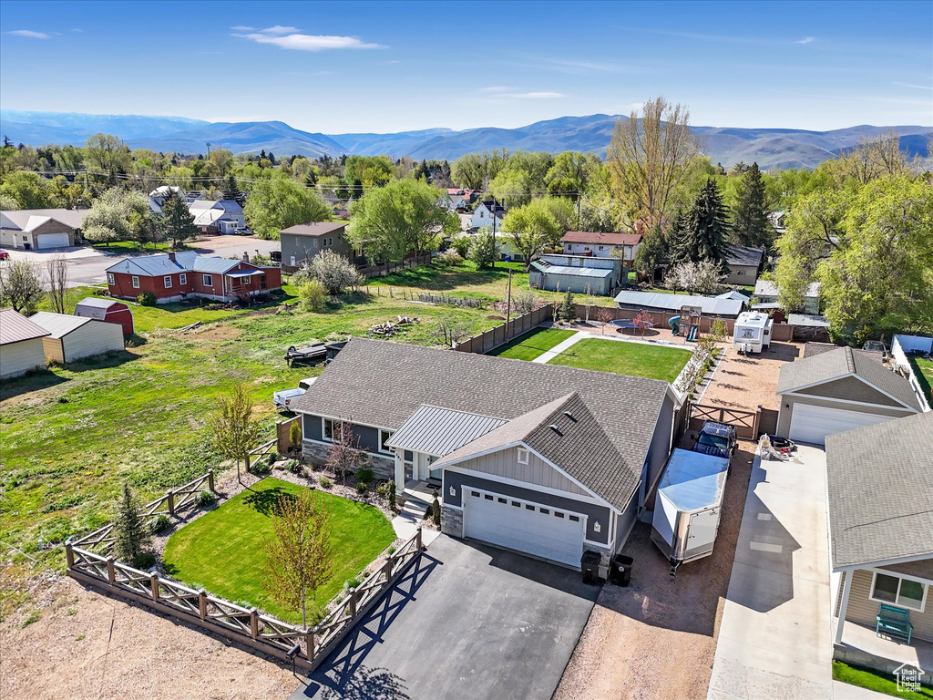 Aerial perspective of suburban area with a mountainous background
