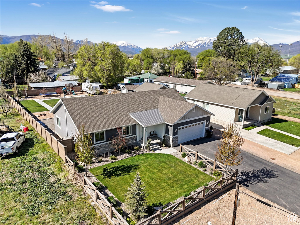 Aerial view of residential area featuring a mountainous background