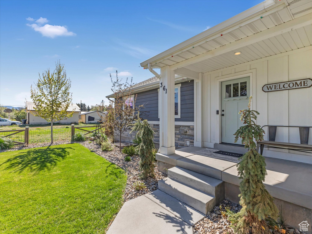 Property entrance with stone siding