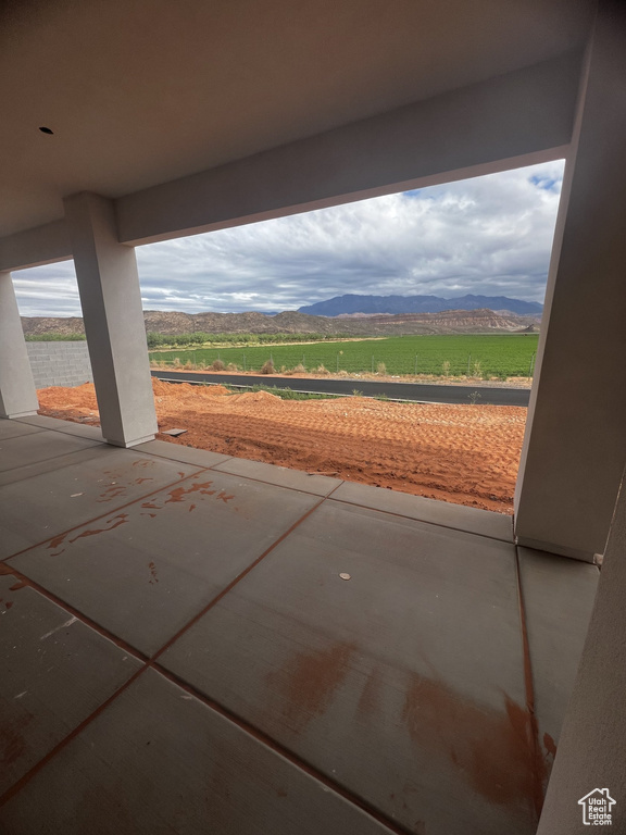 View of patio / terrace featuring a mountain view and a view of countryside