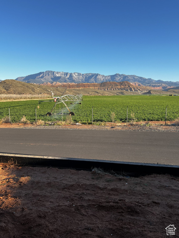 View of mountain backdrop featuring rural landscape