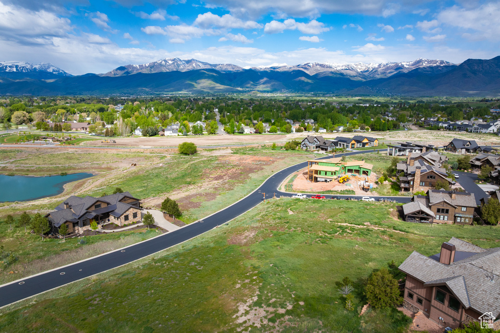 Aerial view of residential area featuring a water and mountain view