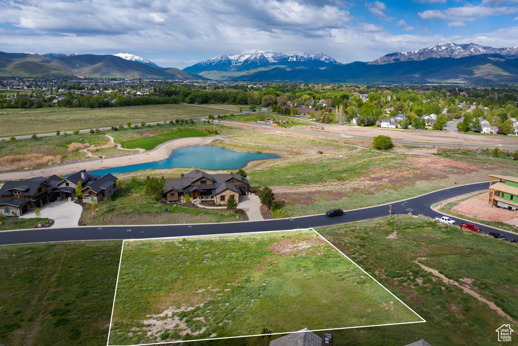 View of property location featuring a water and mountain view and property boundaries highlighted