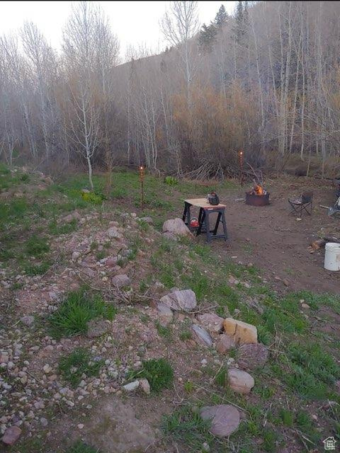 View of yard featuring a fire pit