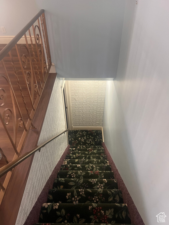 Stairway featuring carpet