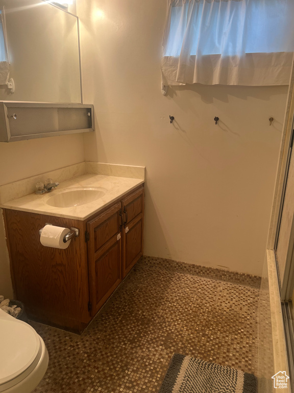 Bathroom featuring toilet and vanity