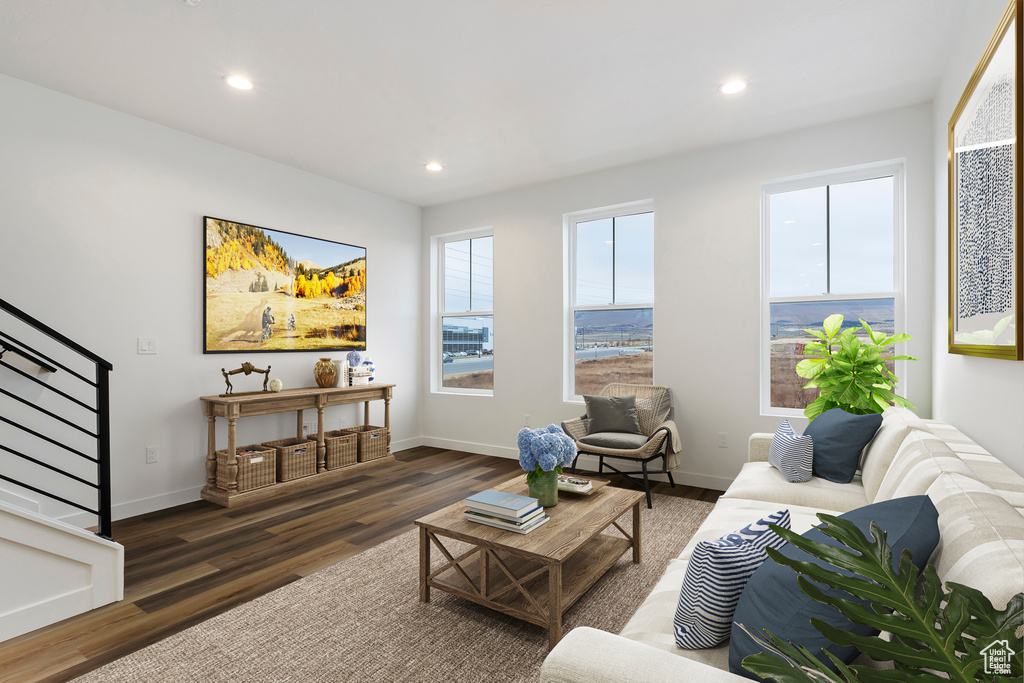 Living area featuring stairway, recessed lighting, baseboards, and wood finished floors