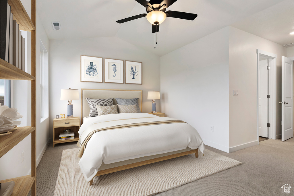 Bedroom featuring a ceiling fan, carpet, visible vents, baseboards, and vaulted ceiling