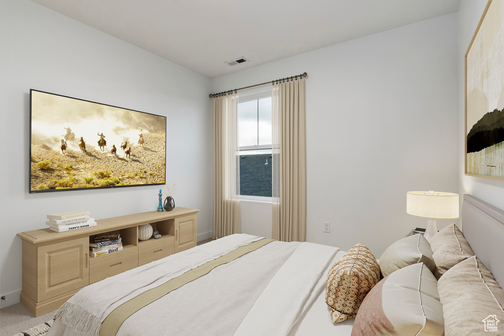 Bedroom with visible vents and carpet flooring