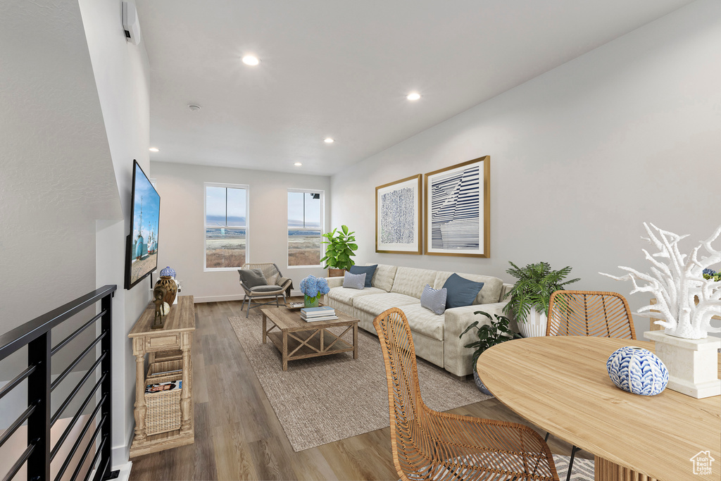 Living room with recessed lighting and wood finished floors