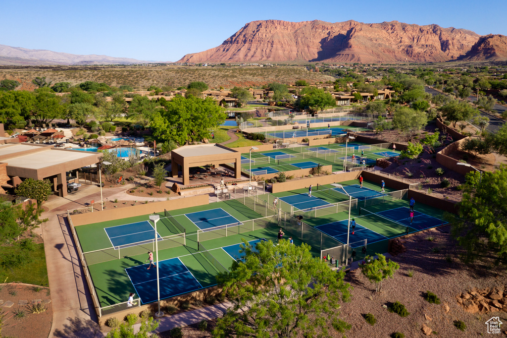 Aerial view of a mountainous background and a pool