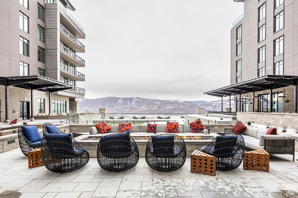 View of patio / terrace with an outdoor living space and a mountain view