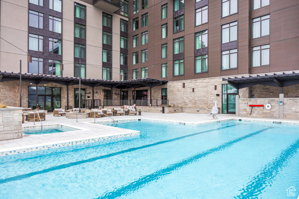 Community pool featuring a patio