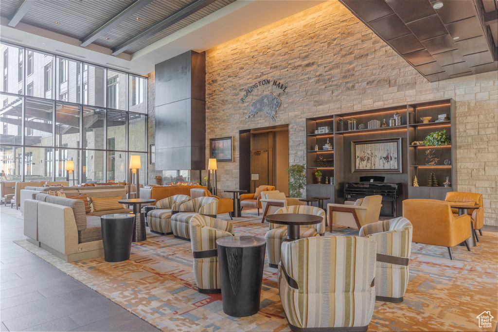 Building lobby featuring a high ceiling and beamed ceiling