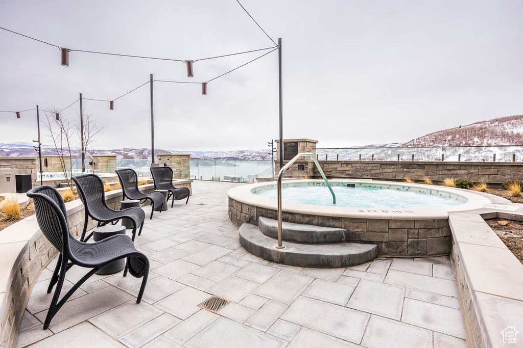 View of swimming pool featuring a mountain view and a patio