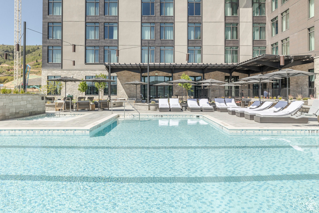Community pool with a patio area