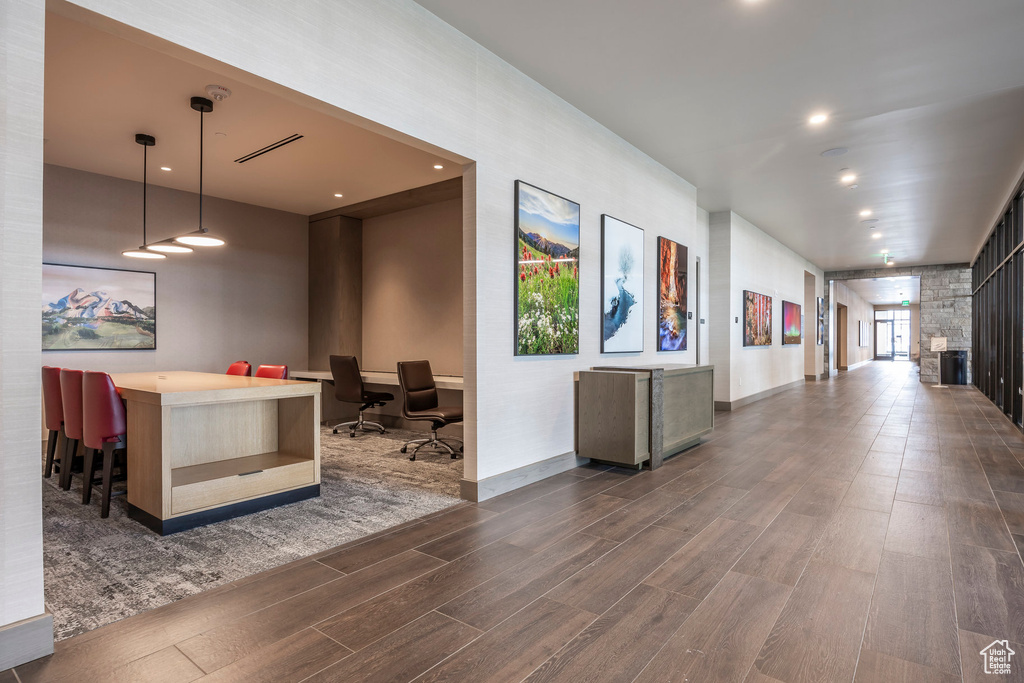 Interior space with recessed lighting, dark wood-type flooring, and baseboards
