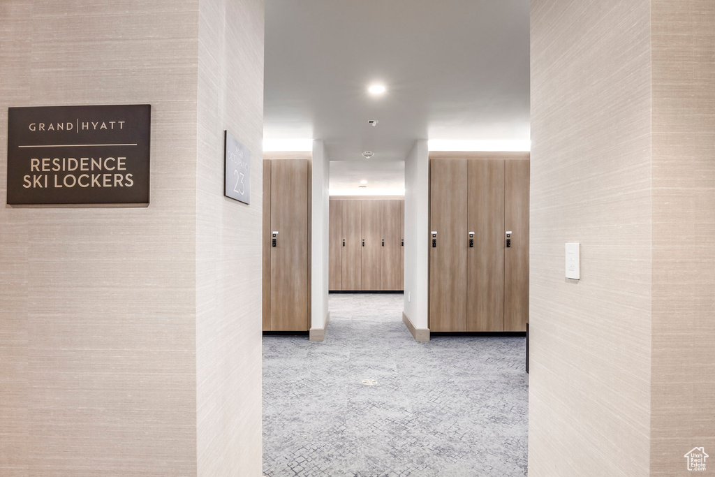Corridor featuring carpet